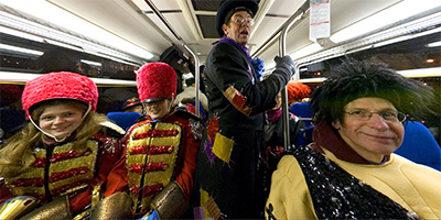 Busload of fairy tale characters after Holidazzle.