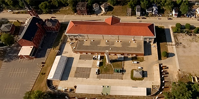 Barn and orange roof bldg. on N. shore of Ohio River, E. of Lunken
