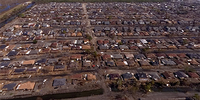 Aerial panorama over the muddy streets of Chalmette after Katrina.