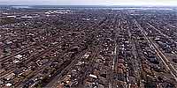 Aerial panorama over the muddy streets of Chalmette after Katrina.